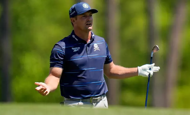 Bryson DeChambeau watches his tee shot on the 12th hole during the first round of the Masters golf tournament at the Augusta National Golf Club, Thursday, April 9, 2026, in Augusta, Ga. (AP Photo/Eric Gay)