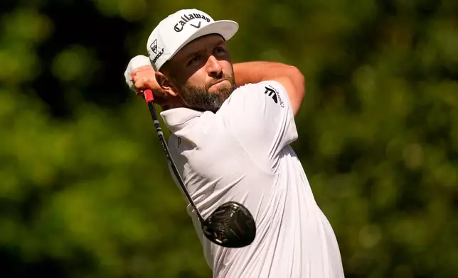 Jon Rahm, of Spain, watches his tee shot on the 11th hole during the first round of the Masters golf tournament at the Augusta National Golf Club, Thursday, April 9, 2026, in Augusta, Ga. (AP Photo/Gerald Herbert)