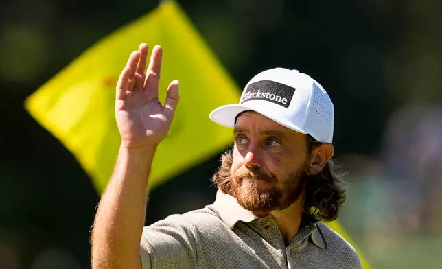 Tommy Fleetwood, of England, waves after his putt on the 10th hole during the second round of the Masters golf tournament at the Augusta National Golf Club, Friday, April 10, 2026, in Augusta, Ga. (AP Photo/Gerald Herbert)