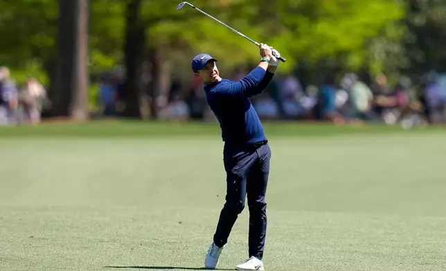 Rory McIlroy, of Northern Ireland, hits from the fairway on the 15th hole during the first round of the Masters golf tournament at the Augusta National Golf Club, Thursday, April 9, 2026, in Augusta, Ga. (AP Photo/David J. Phillip)