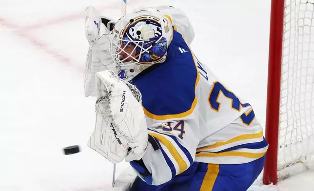 Buffalo Sabres' Alex Lyon makes a save during the third period in Game 4 of a first-round NHL hockey Stanley Cup playoff series against the Boston Bruins, Sunday, April 26, 2026, in Boston. (AP Photo/Michael Dwyer)