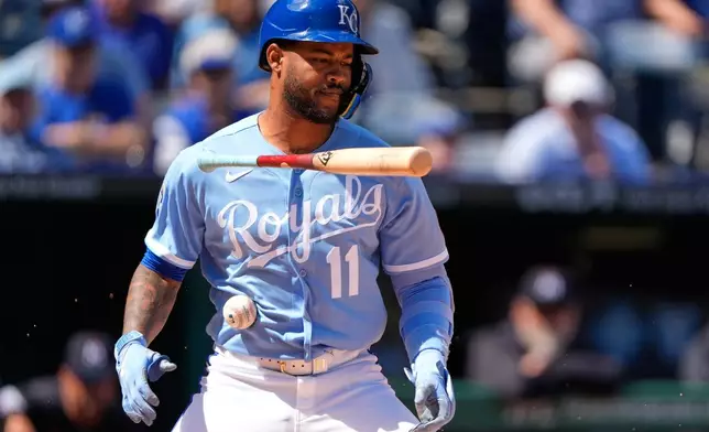 Kansas City Royals' Maikel Garcia is hit by a ball that bounced off the catcher during the third inning of a baseball game against the Minnesota Twins, Thursday, April 2, 2026, in Kansas City, Mo. (AP Photo/Charlie Riedel)