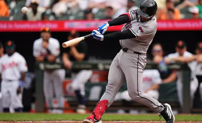 Arizona Diamondbacks' Adrian del Castillo hits a two-run home run during the 10th inning of a baseball game against the Baltimore Orioles, Wednesday, April 15, 2026, in Baltimore. (AP Photo/Stephanie Scarbrough)