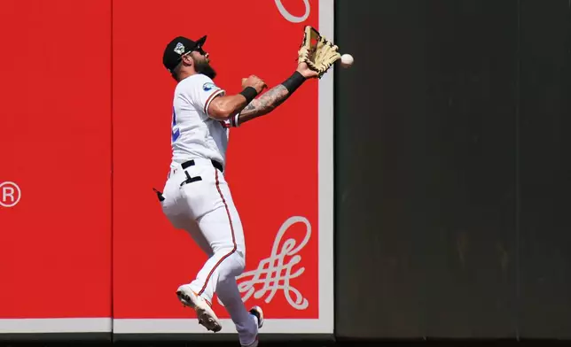 Baltimore Orioles left fielder Weston Wilson is unable to catch a two-run triple hit by Arizona Diamondbacks' Adrian del Castillo during the third inning of a baseball game, Wednesday, April 15, 2026, in Baltimore. (AP Photo/Stephanie Scarbrough)