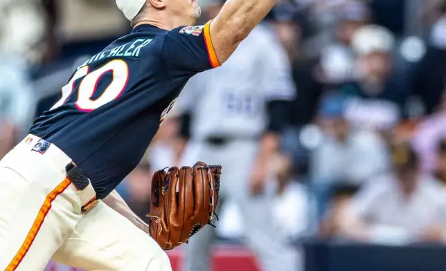 San Diego Padres starting pitcher Walker Buehler throws to a Colorado Rockies batter in the first inning of a baseball game, Friday, April 10, 2026, in San Diego. (AP Photo/Tony Ding)