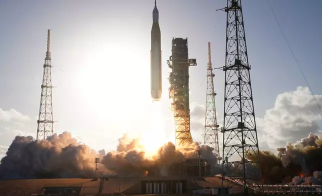 The NASA Artemis II SLS (Space Launch System) rocket with the Orion spacecraft launches at the Kennedy Space Center, Wednesday, April 1, 2026, in Cape Canaveral, Fla. (AP Photo/John Raoux)