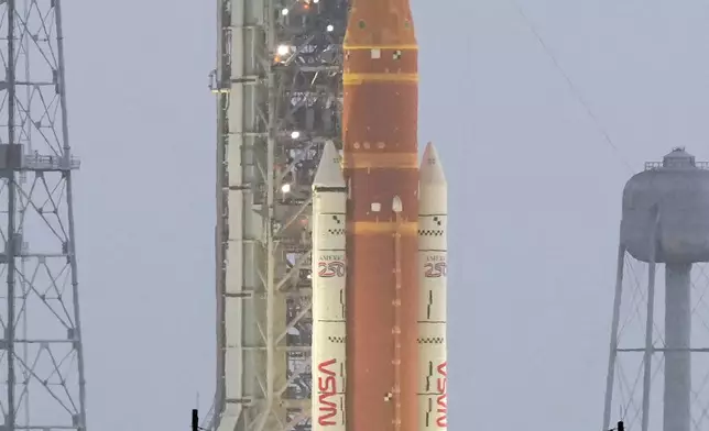 NASA's Artermis II moon rocket sits on Launch Pad 39-B at the Kennedy Space Center hours ahead of planned liftoff Wednesday, April 1, 2026, in Cape Canaveral, Fla. (AP Photo/Chris O'Meara)