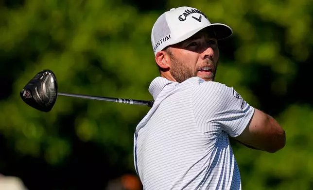 Sam Burns watches his tee shot on the 11th hole during the third round of the Masters golf tournament at the Augusta National Golf Club, Saturday, April 11, 2026, in Augusta, Ga. (AP Photo/David J. Phillip)