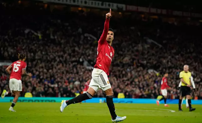Manchester United's Casemiro celebrates after scoring during the Premiier League soccer match between Manchester United and Leeds in Manchester, England, Monday, April 13, 2026. (AP Photo/Dave Thompson)