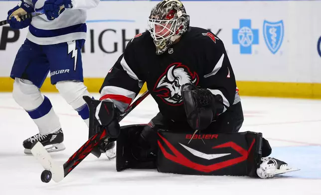 Buffalo Sabres goaltender Ukko-Pekka Luukkonen (1) makes a stick save during the second period of an NHL hockey game against the Tampa Bay Lightning Monday, April 6, 2026, in Buffalo, N.Y. (AP Photo/Jeffrey T. Barnes)