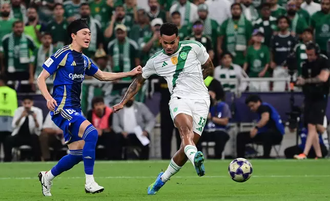 Machida Zelvia's Hotaka Nakamura, left, fights for the ball with Al-Ahli's Galeno during their AFC Champions League Elite Final soccer match at King Abdullah Sports City Stadium, in Jeddah, Saudi Arabia, Saturday, April 25, 2026. (AP Photo/Ali Issa)