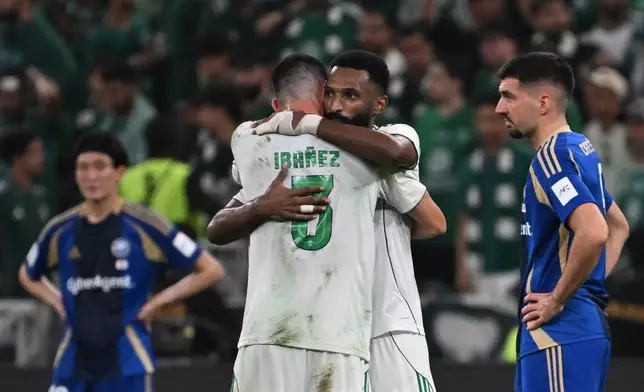 Al-Ahli's Feras Albrikan hugs his teammate Ibanez after scoring at Machida Zelvia, during the AFC Champions League Elite Final soccer match between Al-Ahli and Machida Zelvia at King Abdullah Sports City Stadium, in Jeddah, Saudi Arabia, Saturday, April 25, 2026. (AP Photo/Ali Issa)