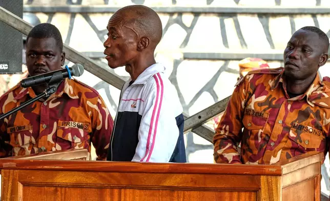 Christopher Okello Onyum, a man accused of killing four children, appears in court at the Ggaba Community Church grounds, in Kampala, Uganda, Monday, April 13, 2026. (AP Photo/Hajarah Nalwadda)