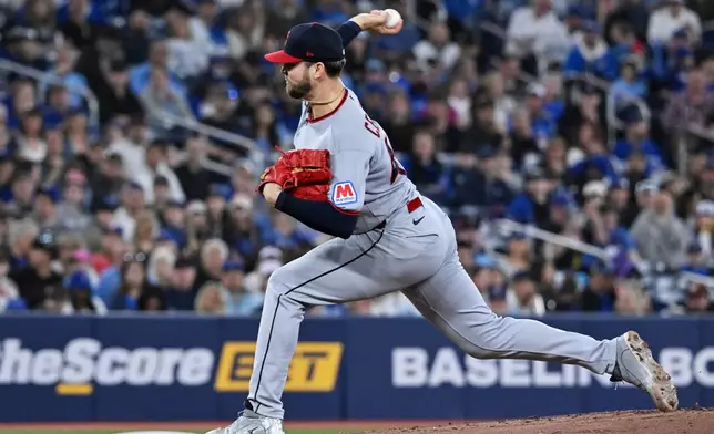 Cleveland Guardians starting pitcher Slade Cecconi (44) throws to a Toronto Blue Jays batter in the first inning of a baseball game, in Toronto, Sunday, April 26, 2026. (Jon Blacker/The Canadian Press via AP)