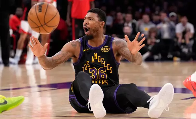 Los Angeles Lakers guard Marcus Smart reacts after being called for a foul during the first half in Game 2 of a first-round NBA playoffs basketball series against the Houston Rockets, Tuesday, April 21, 2026, in Los Angeles. (AP Photo/Mark J. Terrill)