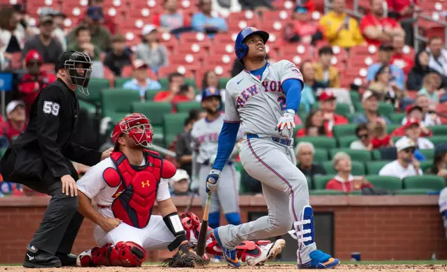 New York Mets' Juan Soto hits a home run in the sixth inning of a baseball game against the St. Louis Cardinals Wednesday, April 1, 2026, in St. Louis. (AP Photo/LG Patterson)