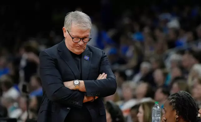 UConn head coach Geno Auriemma reacts during the second half of a woman's NCAA college basketball tournament semifinal game between UConn and South Carolina at the Final Four, Friday, April 3, 2026, in Phoenix. (AP Photo/Ross D. Franklin)