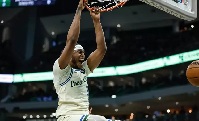 Milwaukee Bucks center Myles Turner reacts after dunking during the first half of an NBA basketball game against the Brooklyn Nets, Friday, April 10, 2026, in Milwaukee. (AP Photo/Jeffrey Phelps)