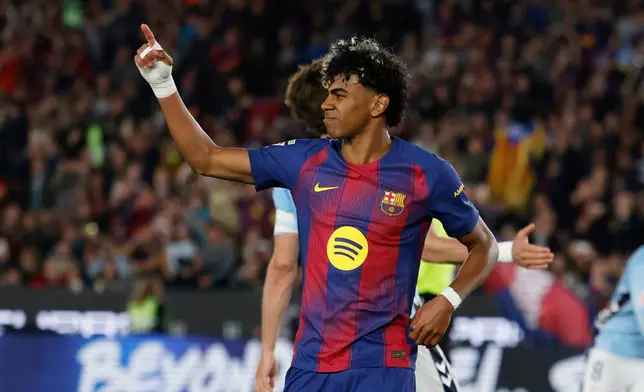 Barcelona's Lamine Yamal celebrates after scoring the opening goal during the Spanish La Liga soccer match between Barcelona and Celta Vigo in Barcelona, Spain, Wednesday, April 22, 2026. (AP Photo/Joan Monfort)
