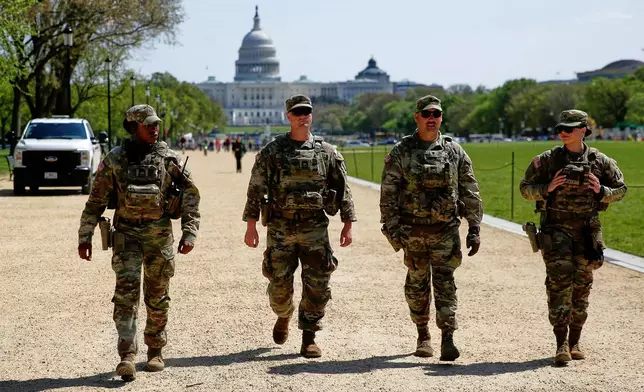 FILE National Guard patrol the Washington Mall, with the U.S. Capitol in the background, April 7, 2026, in Washington. (AP Photo/Rahmat Gul, File)