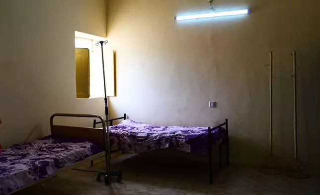 Empty beds at a public health clinic in Qoz Nafisa village, Khartoum state, Sudan, Wednesday, April 22, 2026. (AP Photo/Bernat Armangue)