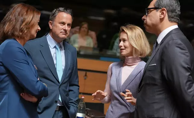 European Union foreign policy chief Kaja Kallas, second right, speaks with from left, Slovenia's Foreign Minister Tanja Fajon, Luxembourg's Foreign Minister Xavier Bettel and Cypriot Foreign Minister Constantinos Kombos during a round table meeting of EU foreign ministers at the European Council building in Luxembourg, Tuesday, April 21, 2026. (AP Photo/Virginia Mayo)