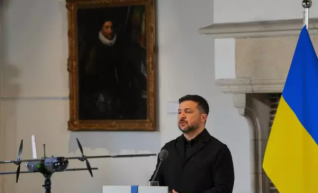Ukraine's President Volodymyr Zelenskyy speaks next to a drone after he received the International Four Freedoms Award, in Middelburg, Netherlands, Thursday, April 16, 2026. (AP Photo/Peter Dejong)