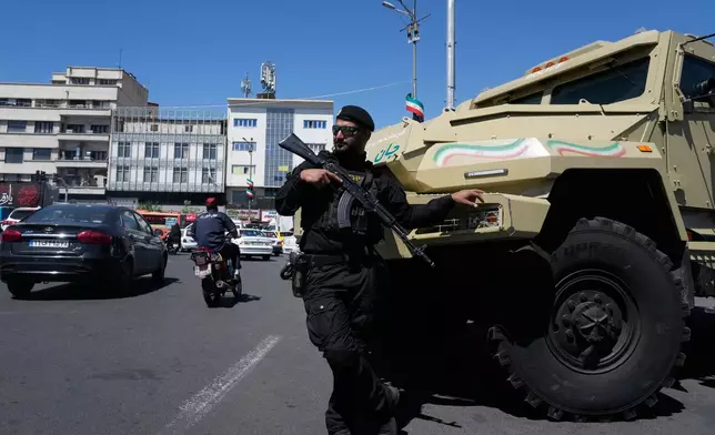 A member of Iran's police special forces stands guard in Tehran, Iran, Friday, April 24, 2026. (AP Photo/Vahid Salemi)