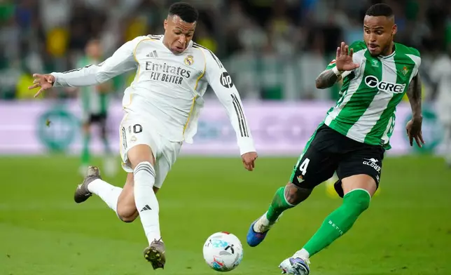 Betis' Natan guards Real Madrid's Kylian Mbappe during a La Liga soccer match between Real Betis and Real Madrid in Seville, Spain, Friday, April 24, 2026. (AP Photo/Jose Breton)