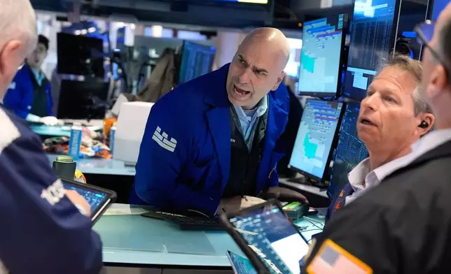 Philip Finale works on the floor at the New York Stock Exchange in New York, Tuesday, April 7, 2026. (AP Photo/Seth Wenig)