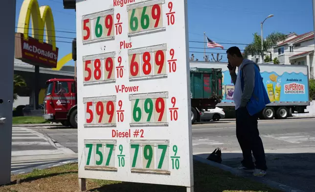 FILE - Gas prices are displayed at a gasoline station, Tuesday, April 7, 2026, in Los Angeles. (AP Photo/Damian Dovarganes, File)