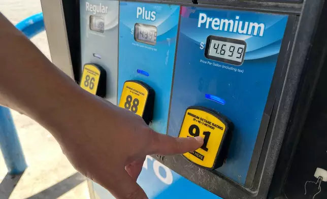 A customer opts for premium grade fuel at a tribally owned gas station near Sandia Pueblo, New Mexico, on Thursday, April 9, 2026. (AP Photo/Susan Montoya Bryan)