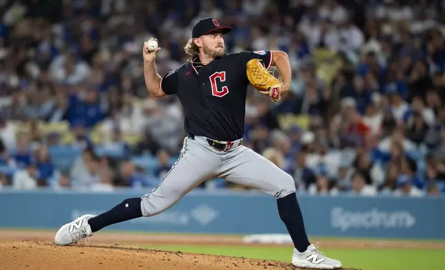 Cleveland Guardians starting pitcher Tanner Bibee delivers during the second inning of a baseball game against the Los Angeles Dodgers in Los Angeles, Tuesday, March 31, 2026. (AP Photo/Kyusung Gong)