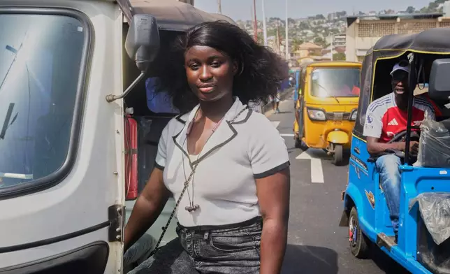 Halimatu Kamara, a rickshaw driver poses for a portrait in Freetown, Sierra Leone, March 7, 2026. (AP Photo/Abdul Hamid Kanu)