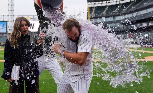 Chicago White Sox's Tristan Peters (29) is doused to celebrate his walk-off RBI single to win a home-opener baseball game against the Toronto Blue Jays, Friday, April 3, 2026, in Chicago. (AP Photo/Erin Hooley)
