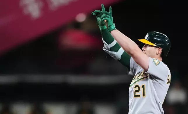 Athletics' Tyler Soderstrom celebrates a double against the Seattle Mariners during the sixth inning of a baseball game, Tuesday, April 21, 2026, in Seattle. (AP Photo/Lindsey Wasson)