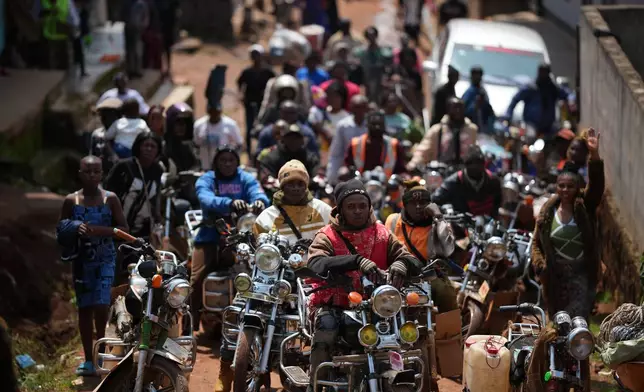 FILE - People wait for Pope Leo XIV in Bamenda, Cameroon, Thursday, April 16, 2026, on the fourth day of his 11-day pastoral visit to Africa. (AP Photo/Andrew Medichini, File)