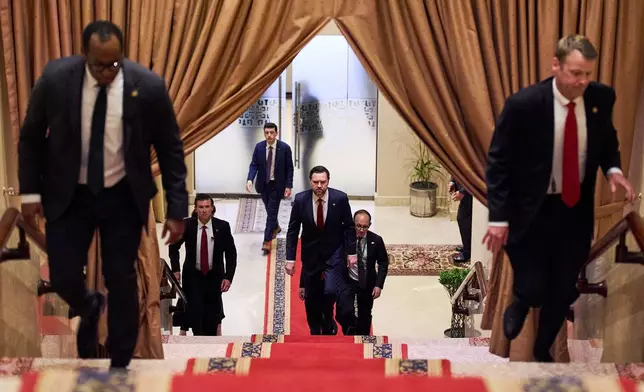 FILE - U.S. Vice President JD Vance, center, walks up a flight of stairs to meet with Pakistan's Prime Minister Shehbaz Sharif, Saturday, April 11, 2026, in Islamabad, for talks about Iran. (AP Photo/Jacquelyn Martin, pool, File)