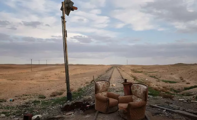 FILE - Two armchairs sit at an abandoned railway crossing used as a checkpoint by the Assad regime's Syrian army, east of Homs, Syria, Saturday, April 11, 2026. (AP Photo/Ghaith Alsayed, File)