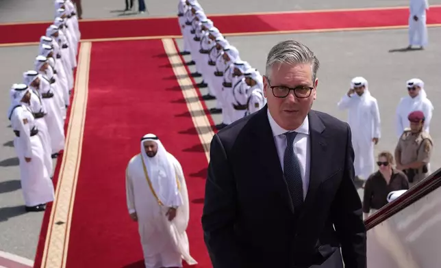 FILE - Britain's Prime Minister Keir Starmer boards a plane at the airport in Doha, Qatar, Friday, April 10, 2026 after his three day visit to the Gulf region.(AP Photo/Alastair Grant, Pool, File)