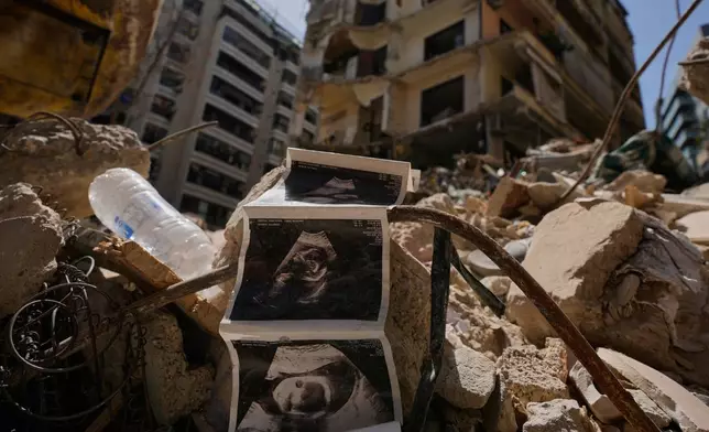 FILE - Sonogram images of a baby lie among the rubble of a destroyed building that was hit a week ago in an Israeli airstrike, in central Beirut, Lebanon, Thursday, April 16, 2026. (AP Photo/Hussein Malla, File)