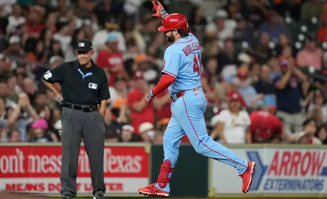 St. Louis Cardinals' Alec Burleson celebrates as he runs the bases after hitting a home run during the seventh inning of a baseball game against the Houston Astros in Houston, Saturday, April 18, 2026. (AP Photo/Ashley Landis)
