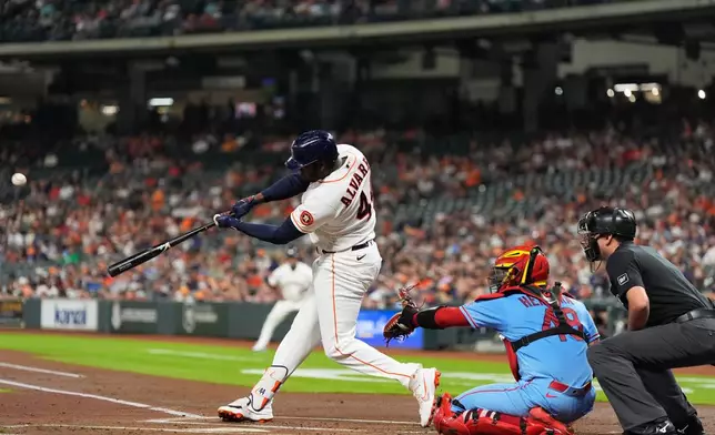 Houston Astros' Yordan Alvarez hits a home run during the first inning of a baseball game against the St. Louis Cardinals in Houston, Saturday, April 18, 2026. (AP Photo/Ashley Landis)