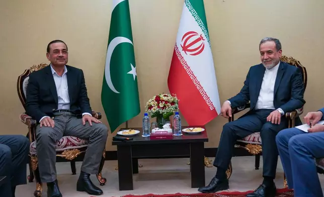 In this photo released by the Iranian Foreign Ministry, Iranian Foreign Minister Abbas Araghchi, right, meets with Pakistan's Army Chief Field Marshal Gen. Asim Munir in Tehran, Wednesday, April 15, 2026. (Iranian Foreign Ministry via AP)