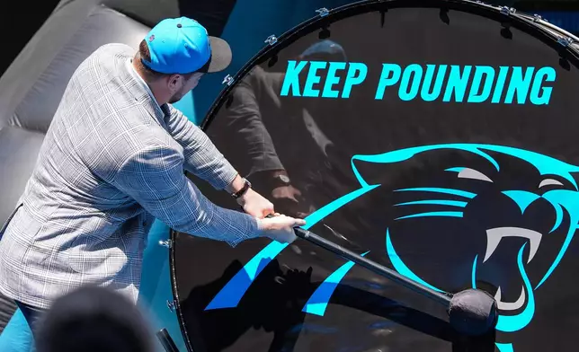 Monroe Freeling, selected in the first round of the NFL football draft by the Carolina Panthers, takes part in a welcome ceremony, Friday, April 24, 2026, in Charlotte, N.C. (AP Photo/Matt Kelley)