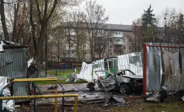 A destroyed car is seen after a Russian strike on residential neighbourhood in Vyshneve, Kyiv region, Ukraine, on Friday, April 3, 2026. (AP Photo/Evgeniy Maloletka)