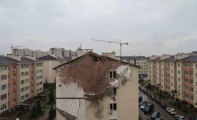 A house is seen damaged after a Russian strike on residential neighbourhood in Kriukivshchyna, Kyiv region, Ukraine, on Friday, April 3, 2026. (AP Photo/Evgeniy Maloletka)