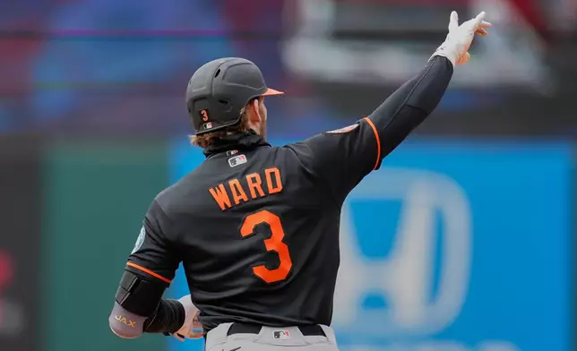 Baltimore Orioles' Taylor Ward (8) gestures as he runs the bases with a home run in the fifth inning of a baseball game against the Cleveland Guardians in Cleveland, Sunday, April 19, 2026. (AP Photo/Sue Ogrocki)