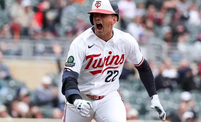 Minnesota Twins' Brooks Lee celebrates a two-run single against the Detroit Tigers during the eighth inning of baseball game, Thursday, April 9, 2026, in Minneapolis. (AP Photo/Matt Krohn)