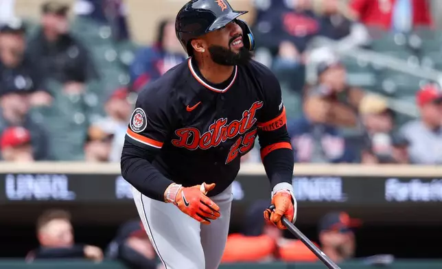 Detroit Tigers designated hitter Gleyber Torres hits an RBI sacrifice fly against the Minnesota Twins during the seventh inning of baseball game, Thursday, April 9, 2026, in Minneapolis. (AP Photo/Matt Krohn)